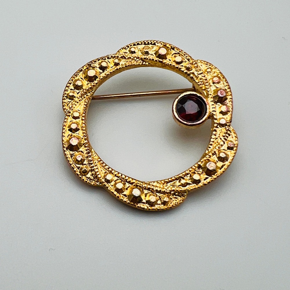 Vintage Gold Tone Textured Wreath Brooch with Red Rhinestone Accent Pin